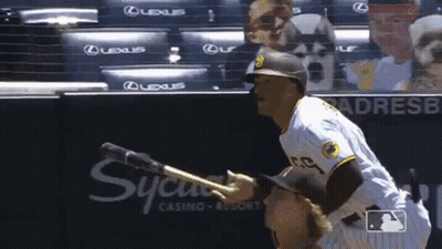 A Baseball Player Wearing A San Diego Padres Uniform Is Pointing At Something GIF