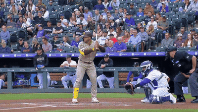 A Baseball Player Wearing A San Diego Padres Uniform Stands At Home Plate Ready To Bat GIF