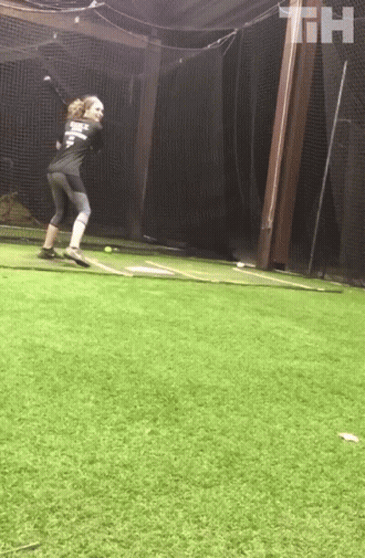 A Baseball Player Wearing A Shirt That Says ' T.h. ' On It Is Throwing A Ball GIF