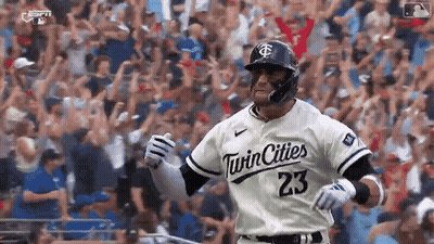 A Baseball Player Wearing A Twin Cities 23 Jersey Is Running On The Field . GIF
