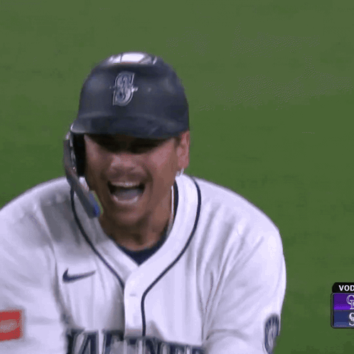 A Baseball Player Wearing A White Jersey That Says Mariner On It GIF