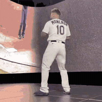 A Baseball Player Wearing A White Jersey With The Number 10 On It GIF