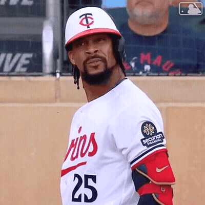 A Baseball Player Wearing A White Jersey With The Number 25 On It GIF