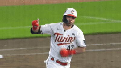 A Baseball Player Wearing A White Jersey With The Word Twins On It GIF