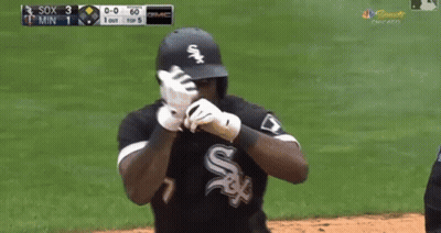 A Baseball Player Wearing A White Sox Jersey Is Standing On The Field GIF