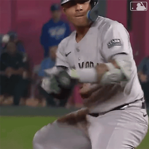 A Baseball Player Wearing A White Uniform With The Word Van On It GIF