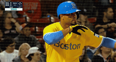 A Baseball Player Wearing A Yellow And Blue Boston Jersey GIF