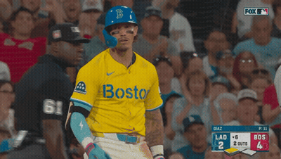 A Baseball Player Wearing A Yellow Jersey With The Word Boston On The Front GIF