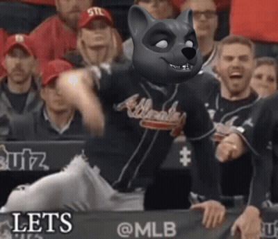 A Baseball Player Wearing An Atlanta Braves Jersey With A Raccoon Mask On His Face GIF