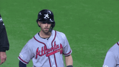 A Baseball Player Wearing An Atlanta Jersey Stands On The Field GIF