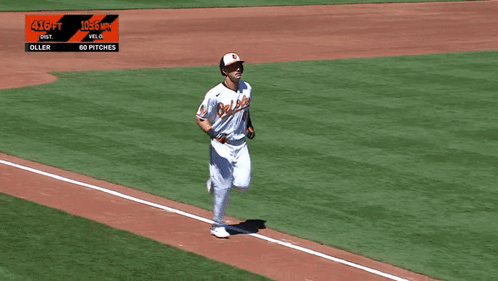 A Baseball Player Wearing An Orioles Jersey Is Running Towards Home Plate GIF