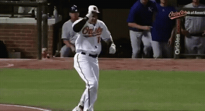 A Baseball Player Wearing An Orioles Uniform Is Running On The Field . GIF