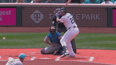 A Baseball Player Wearing Number 22 Swings At A Pitch GIF