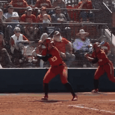 A Baseball Player Wearing Number 23 Is Swinging At A Pitch GIF