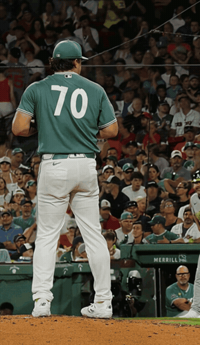A Baseball Player Wearing Number 70 Stands On The Mound GIF