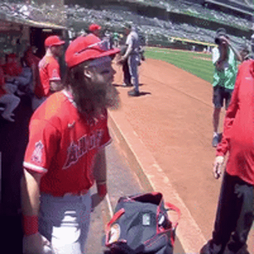 A Baseball Player With A Beard Wearing A Red Angels Jersey GIF