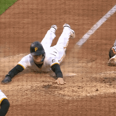A Baseball Player With A P On His Helmet Slides Into Base GIF