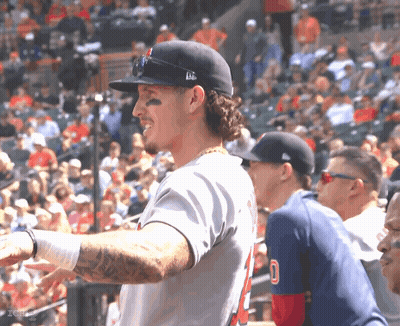 A Baseball Player With A Tattoo On His Arm Is Wearing A Number 5 Jersey GIF