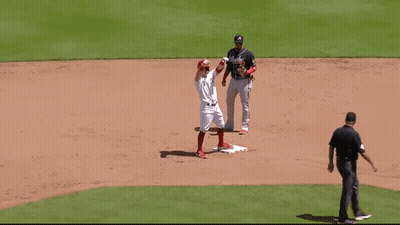 A Baseball Player With The Letter A On His Jersey Is Standing On The Base GIF