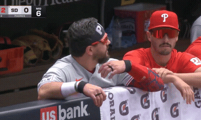 A Baseball Player With The Letter P On His Hat Talks To Another Player GIF