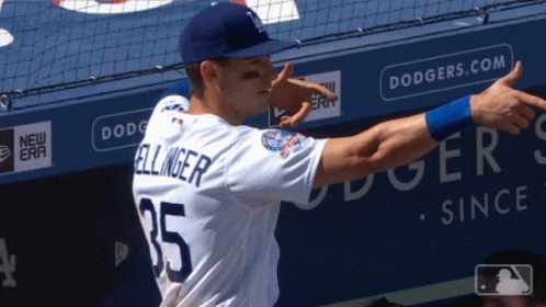 A Baseball Player With The Name Bellinger On His Back GIF