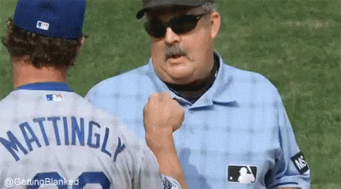 A Baseball Player With The Name Mattingly On The Back Of His Shirt GIF