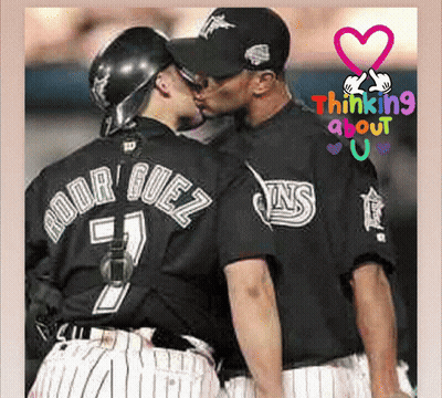 A Baseball Player With The Name Rodriguez On His Back Kisses Another Player GIF