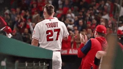 A Baseball Player With The Name Trout On The Back Of His Shirt GIF