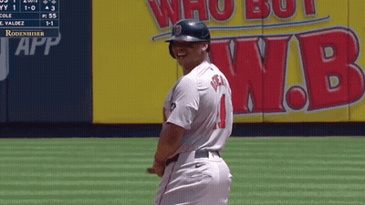 A Baseball Player With The Number 1 On His Jersey Stands On The Field GIF