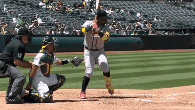 A Baseball Player With The Number 10 On His Jersey Is Swinging At A Pitch GIF