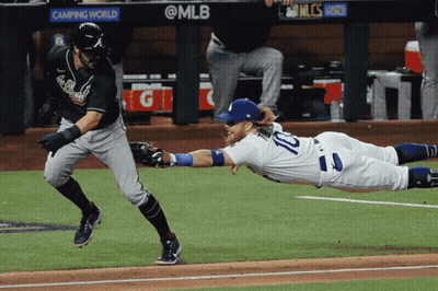 A Baseball Player With The Number 10 On His Jersey Sliding Into Base GIF