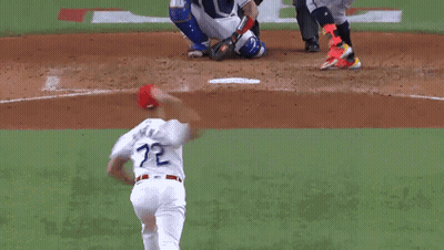 A Baseball Player With The Number 11 On His Jersey Is Sliding Into Home Plate GIF