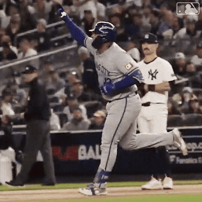 A Baseball Player With The Number 12 On His Jersey Is Running On The Field . GIF