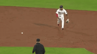 A Baseball Player With The Number 12 On The Back Of His Shirt GIF