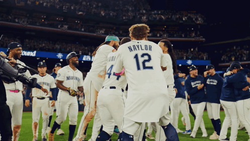 A Baseball Player With The Number 12 On Their Back GIF