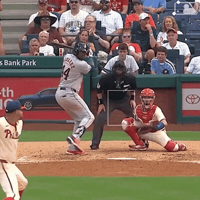 A Baseball Player With The Number 14 On His Jersey Swings His Bat GIF