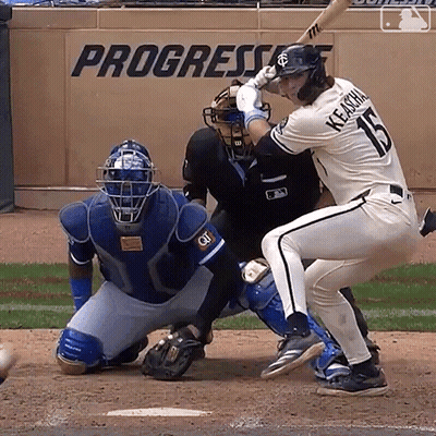 A Baseball Player With The Number 15 On His Jersey Is Swinging His Bat GIF