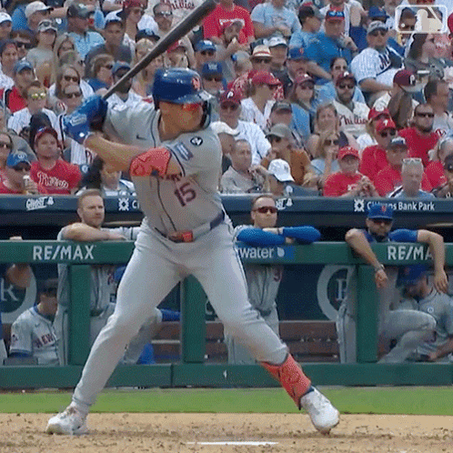 A Baseball Player With The Number 15 On His Jersey Is Swinging His Bat GIF