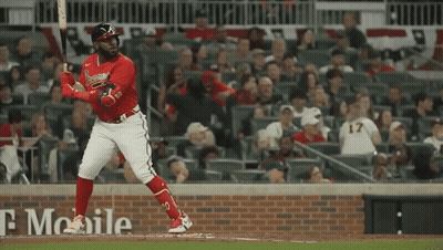 A Baseball Player With The Number 17 On His Jersey Is Swinging His Bat GIF
