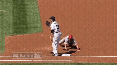 A Baseball Player With The Number 17 On His Jersey Is Trying To Catch A Ball . GIF