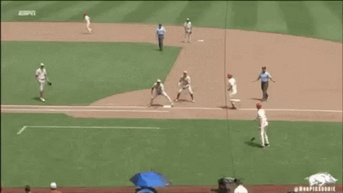 A Baseball Player With The Number 18 On His Jersey Talks To Another Player GIF