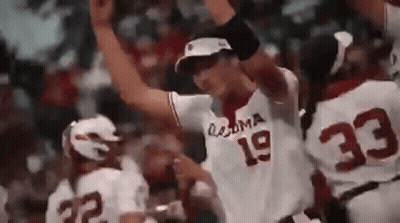 A Baseball Player With The Number 19 On His Jersey Is Standing In Front Of A Crowd . GIF