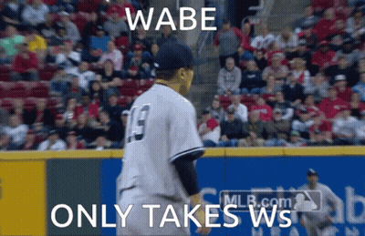 A Baseball Player With The Number 19 On His Jersey Stands On The Field GIF