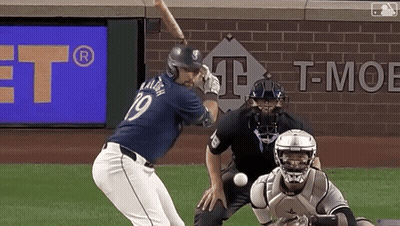 A Baseball Player With The Number 19 On His Jersey Swings At A Ball GIF