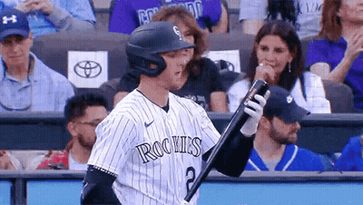 A Baseball Player With The Number 2 On His Jersey Is Holding A Bat . GIF