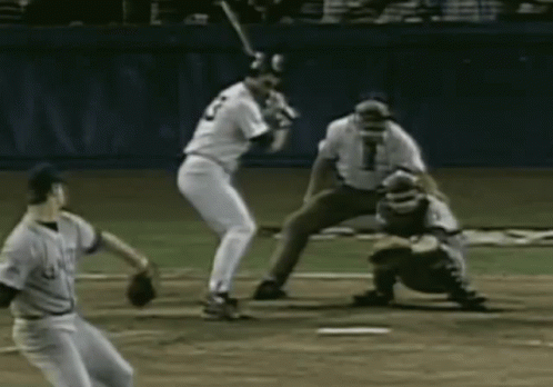 A Baseball Player With The Number 2 On His Jersey Is Swinging A Bat GIF