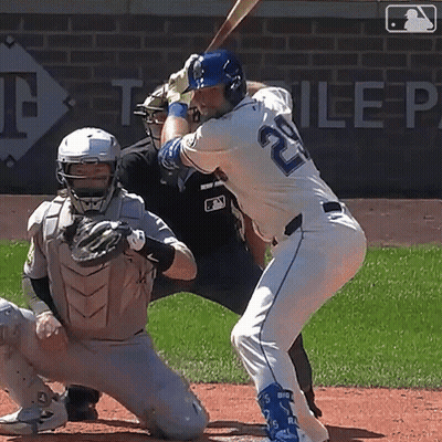 A Baseball Player With The Number 20 On His Jersey Is Swinging His Bat GIF