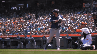 A Baseball Player With The Number 20 On His Jersey Swings His Bat GIF
