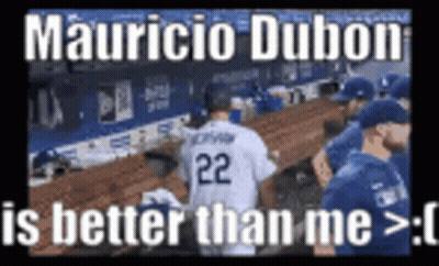 A Baseball Player With The Number 22 On His Jersey Is Standing In The Dugout . GIF