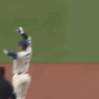 A Baseball Player With The Number 22 On His Jersey Is Standing On The Field GIF